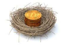 Fund nest egg with bitcoin concept Stack of Bitcoins in a nest for concept of using cryptocurrency as a retirement investment