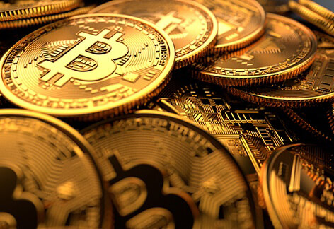 Pile of Bitcoins randomly dropped with bright lighting