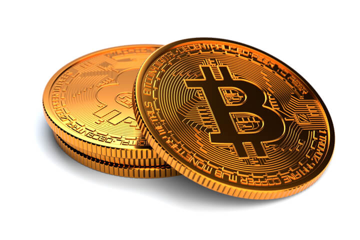 Small stack of Bitcoins isolated on white background