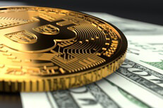 Single bitcoin on currency Single Bitcoin close-up photo laying on U.S. currency