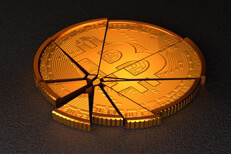 Broken bitcoin concept Broken Bitcoin with spot lighting representing cryptocurrency market crash or steep price decline