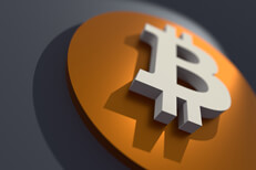 Bitcoin B Logo at angle Angled view of orange and white Bitcoin B logo with short depth of field and spotlight