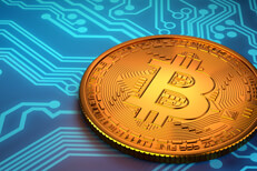 Bitcoin laid on circuit board Bitcoin laid on top of blue circuit board representing digital currency or cryptocurrency