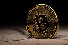 Bitcoin in desert Bitcoin stuck in cracked dry desert mud