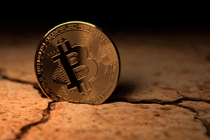 Bitcoin on edge in dry, cracked desert