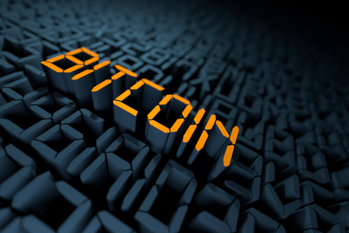 String of encrypted code with gold Bitcoin text extruded upward