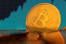 Bitcoin on edge with price chart Single Bitcoin on edge in front of monitor showing increasing stock price of Bitcoin and BTCUSD