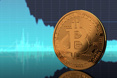 Bitcoin on edge with area chart Bitcoin standing on edge on reflective surface with blue BTC stock price area chart in background