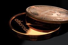 Bitcoin and Ethereum on gloss black Bitcoin and Ethereum coins on glossy reflective black surface
