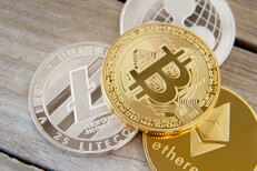 Cryptocurrency coins Free photo of a bitcoin, an Ethereum coin, a Litecoin, and a Ripple coin