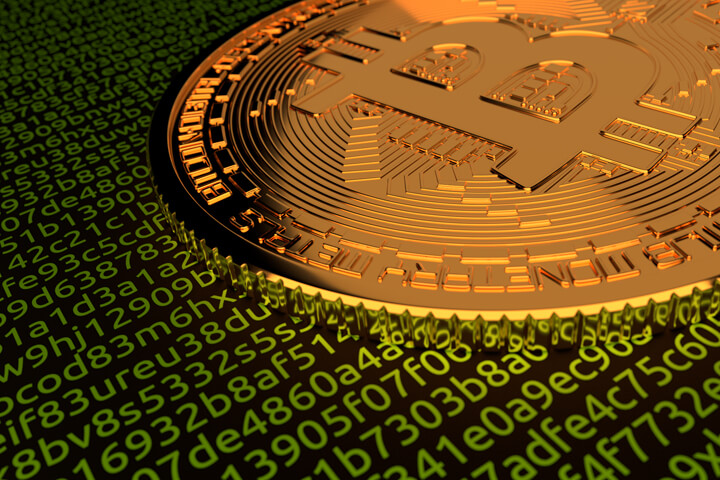 Single Bitcoin lying on green code representing digital blockchain or cryptocurrency technology