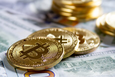 Bitcoins with new 100 dollar bills Bitcoins scattered on new U.S. 100 dollar bills