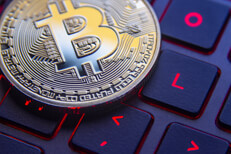 Bitcoin on backlit laptop keyboard Bitcoin on gamer laptop keyboard with screen back light