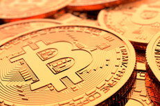 Bitcoin pile close-up view Random pile of Bitcoins with shallow depth-of-field and bright lighting