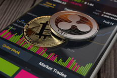 Bitcoin and Ripple on iPhone stock trading app Ripple XRP and Bitcoin on an iPhone screen showing Binance app trading info