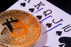 Bitcoin on royal flush card hand in spades gamble concept