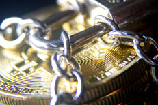 Stack of Bitcoins locked with chains Stack of Bitcoins wrapped with chains and locked with a small padlock