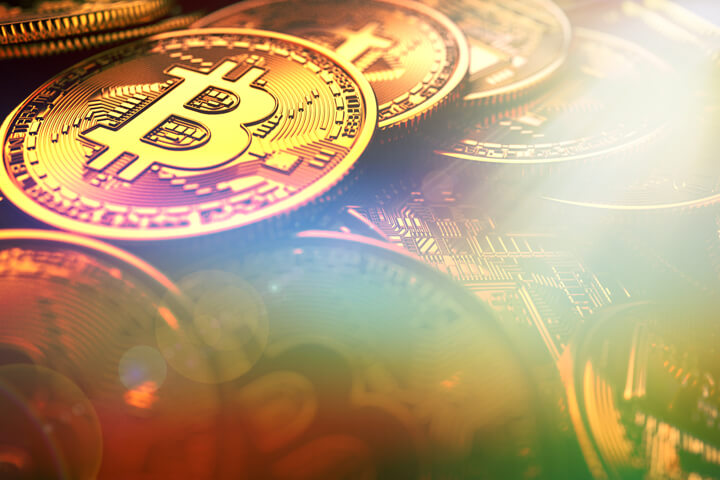 Bitcoins randomly scattered in a pile with lighting and overlay effects