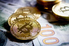 Contrast image of bitcoins and bills Bitcoins on new U.S. 100 dollar bills with high contrast