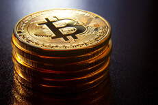 Stack of Bitcoins on shiny texture Stack of Bitcoins on reflective textured surface