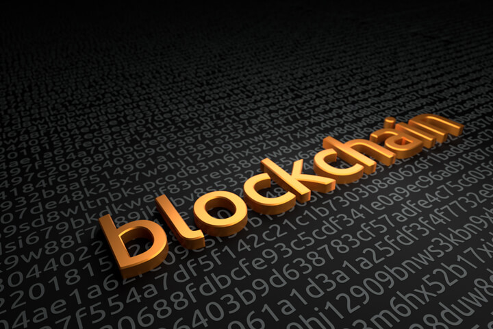 Gold extruded blockchain word on dark background of digital encrypted key or code