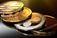 Row of crypto coins with reflection Curved row of crypto coins with gold reflection from window light