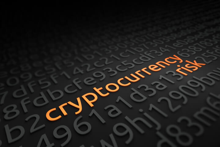 String of encrypted code with words cryptocurrency risk deciphered in orange
