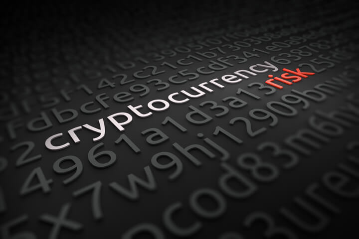 String of encrypted code with words cryptocurrency risk deciphered in white and red
