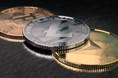 Crypto coins on textured surface Ethereum, Litecoin, and Bitcoin on textured black surface