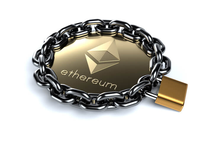 Ethereum coin wrapped in chain and locked with brass padlock