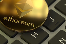 Ethereum on laptop keyboard Ethereum coin with soft window reflection on laptop keyboard