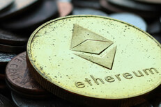 Ethereum and other coins tarnished close Close up photo of a pile of assorted tarnished U.S. coins with Ethereum coin on top