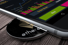 iPhone with Ethereum coin in slot iPhone with Ethereum coin inserted into slot concept for mobile Ether apps, profits, or trades
