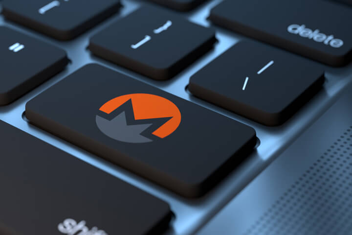 Laptop keyboard with Monero logo cryptocurrency key