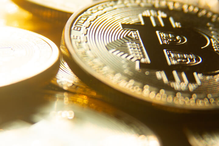 Close view of a random bitcoins with shallow depth of field blur