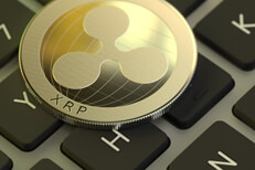 Ripple coin on MacBook Pro keyboard Ripple cryptocurrency coin on Apple MacBook Pro keyboard