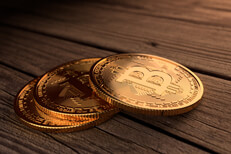 Three Bitcoins on stained wood Three Bitcoins stacked in a row on stained wood planks