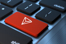 Laptop Tron keyboard key Laptop keyboard with red Tron cryptocurrency key