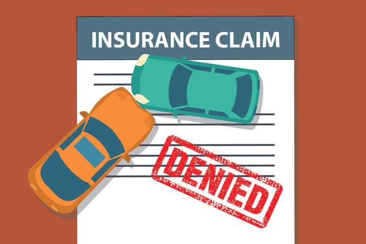 Insurance claim form with two cars colliding and large red DENIED stamp indicating car insurance company denial of a claim