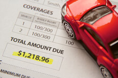 Auto insurance cost Toy car on auto insurance billing statement showing amount due
