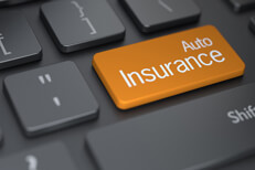 Keyboard with orange auto insurance key Laptop keyboard with large orange auto insurance key concept for buying auto insurance online