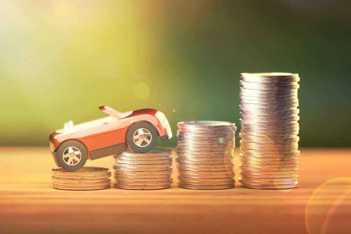 Toy car climbing increasing stacks of coins with corner light flare and overlay effect