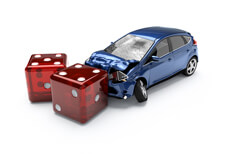Auto insurance dice roll Concept image for insurance risk or taking chances on being uninsured
