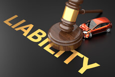 Car crashed into gavel with shiny gold LIABILITY letters