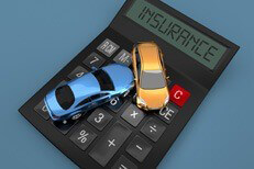 Small cars on insurance calculator Two car accident on insurance calculator from top viewpoint