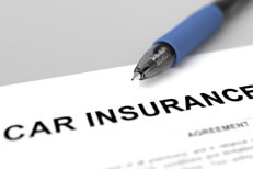 Car insurance policy and pen Car insurance policy close up image with ink pen