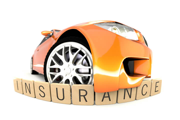 Orange sports car with front bumper wrapping over wooden insurance letters