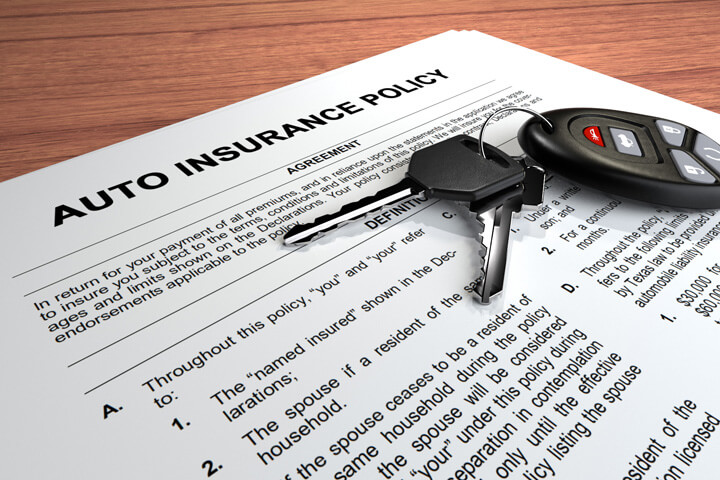 Auto insurance policy on desk larger f-stop