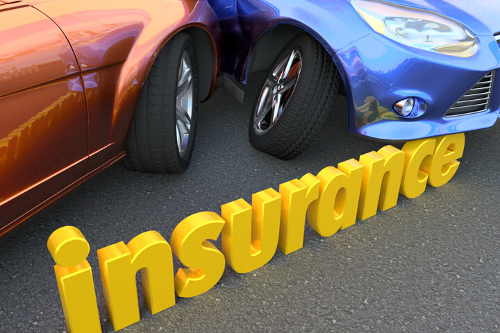 Two car accident in background with word insurance in foreground
