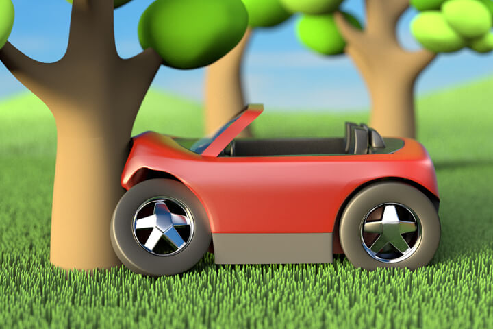 Side view of cute red convertible crashed into tree with hills and trees in background